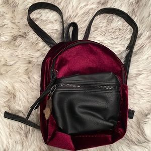 🎒Small Backpack🎒in burgundy red velvet/valour with lucky rabbit’s foot!